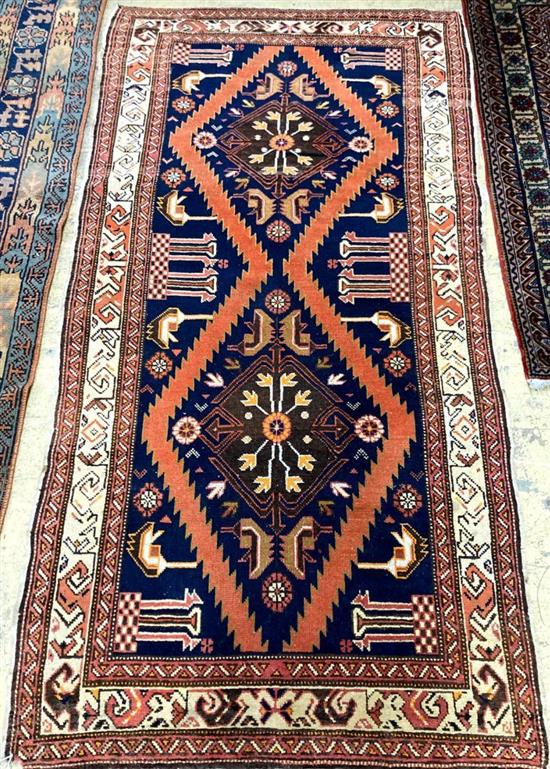 A Kurdish blue ground rug, 226 x 112cm